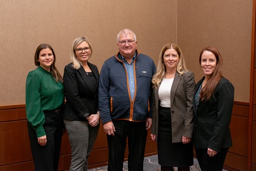 Five CISSSME team members standing together and smiling.