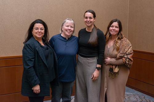 Four Loch Lomond Villa team members standing together and smiling.