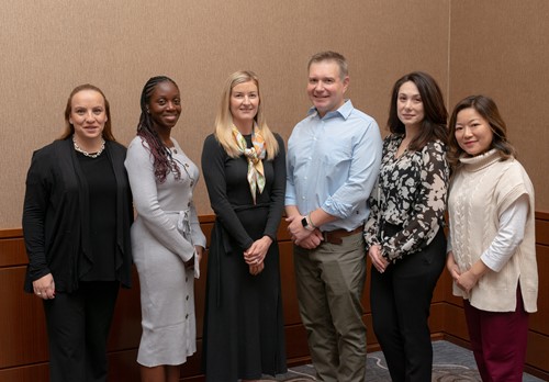 Six Michael Garron Hospital – Oxenham team members standing together and smiling.