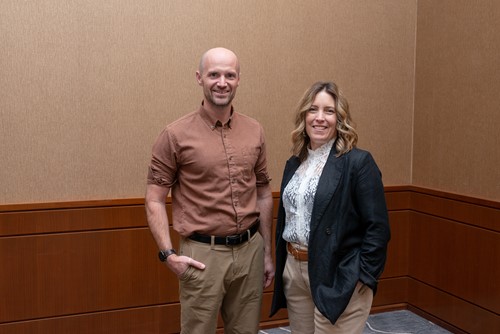 Two Saskatchewan Health Authority team members standing together and smiling.