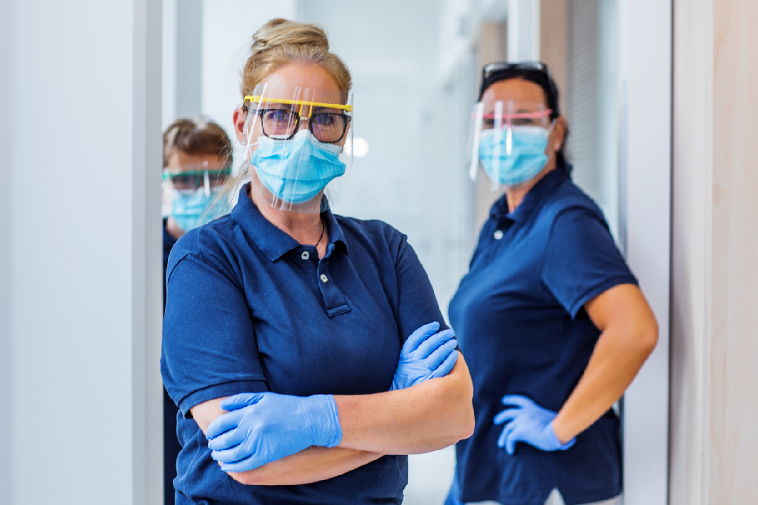 Healthcare workers standing wearing PPE